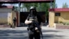 Pro-Russian armed separatists guard a street near an administrative building in Donetsk, eastern Ukraine, May 6, 2014.