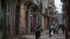 FILE - People walk on a street in Havana, Cuba, April 10, 2019. 