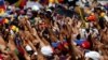 Supporters greet Carlos Vecchio, the national political coordinator of the Popular Will party, an anti-government group formed by jailed opposition leader Leopoldo Lopez, during an anti-government protest in Caracas, Venezuela, March 22, 2014.