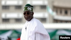 FILE - Nigeria's President Bola Tinubu after his swearing-in ceremony in Abuja, Nigeria May 29, 2023. Tinubu is calling for an investigation into a deadly drone attack.