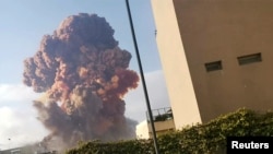 Smoke rises after an explosion in Beirut, Lebanon August 4, 2020, in this picture obtained from a social media video. Karim Sokhn/Instagram/Ksokhn + Thebikekitchenbeirut/via REUTERS 