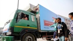 A pickup van carries Oxford-Astrazeneca COVID-19 vaccines, which arrived from India as a gift to Bangladesh, from the Hazrat Shahjalal International Airport to the storage house, in Dhaka, Bangladesh January 21, 2021. REUTERS/Mohammad Ponir Hossain
