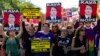 Demonstrators protest against Supreme Court nominee Brett Kavanaugh as they march to the U.S. Supreme Court, Oct. 4, 2018, in Washington. 