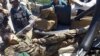 The body of an Afghan national army soldier lies in an army vehicle after he opened fire on U.S. troops, in the compound of the provincial governor, Jalalabad, east of Kabul, Afghanistan, April 8, 2015.