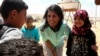 U.S. Ambassador to the United Nations Nikki Haley, speaks with Syrian refugee children, during a visit to the Zaatari Refugee Camp, Jordan, May 21, 2017. 