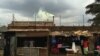 Yellow smoke from a factory behind shops in Nairobi’s Baba Dogo neighborhood. (Steve Baragona/VOA)