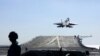 ILUSTRASI - Jet tempur J-15 dari kapal induk Liaoning Angkatan Laut China lepas landas untuk latihan tempur di perairan terbuka yang meliputi Laut Kuning, Laut Timur, dan Pasifik Barat. (Xinhua via AFP)