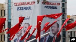Turkey's President Recep Tayyip Erdogan's ruling Justice and Development Party's (AKP) campaign poster is seen in Instanbul's Taksim Square, April 4, 2019.