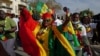 FILE - Supporters of Senegalese President Macky Sall march in support of him after he postponed presidential elections, in Dakar on Feb. 24, 2024. The election will now be held on March 24, following a ruling by the Constitutional Council on March 6.