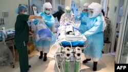 medical staff in protective suits
