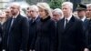 (L-R) Belgian Prime Minister Charles Michel, Queen Mathilde and King Philippe attend a commemoration ceremony at the Belgian parliament for victims of Tuesday's bombing attacks in Brussels, Belgium, March 24, 2016. 