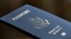 FILE - A passport cover is displayed in Tigard, Oregon, on Dec. 11, 2021. The U.S. State Department announced on Sept. 18, 2024, that its new online passport renewal system is fully operational.