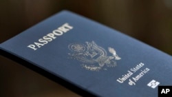 FILE - A passport cover is displayed in Tigard, Oregon, on Dec. 11, 2021. The U.S. State Department announced on Sept. 18, 2024, that its new online passport renewal system is fully operational.