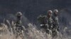 South Korean army soldiers move during their military exercise near the demilitarized zone between the two Koreas in Paju, South Korea, Monday, March 2, 2015.