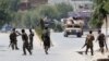 Afghan National Army (ANA) soldiers arrive at the site of gunfire and attack in Jalalabad city, Afghanistan, July 11, 2018. 