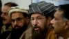 FILE - Pakistani religious cleric, Sami-ul-Haq, second right, addresses a news conference with, Hameed Gul, former chief of Pakistan's intelligence, left, in Islamabad, Pakistan.