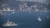 FILE - Turkish Navy vessels cross the Bosporus Strait in Istanbul, March 9, 2019, upon completion of massive military drills. A joint naval drill between Russia and Turkey last Friday in the Black Sea was part of Turkey's broader military exercise.