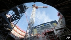 The Tokamak complex is pictured at the construction site of the ITER ( the International Thermonuclear Experimental Reactor), in the CEN of Cadarache, in Saint-Paul-Lez-Durance, southern France, Wednesday, Dec. 13, 2017.