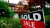 FILE - A sale sign in Wyndmoor, Pennsylvania, June 22, 2022. The National Association of Realtors agreed on March 15, 2024, to pay $418 million and change its rules to settle lawsuits claiming home sellers have been unfairly forced to pay artificially inflated agent commissions.