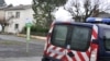 A French police vehicle is parked near a house where an alleged jihadist was arrested earlier on December 15, 2014, in Graulhet, southwestern France.