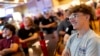 Evan Manni watches the presidential candidates' debate between Republican Donald Trump and Democrat Kamala Harris at Dan's Place in West Greenwich, Rhode Island, Sept. 10, 2024.