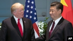 Presidentes Trump y Xi Jinping en julio 2017