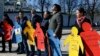 FILE - Activists take part in a flashmob to highlight human rights violations against Tatars living in Russia-annexed, in Kyiv, Ukraine, March 16, 2016.