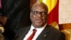 FILE - Mali&#39;s President Ibrahim Boubacar Keita answers a question upon his arrival at Algiers airport, Jan. 18, 2014.