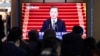 People watch a TV screen showing the live broadcast of South Korean President Moon Jae-in's New Year's speech at the Seoul Railway Station in Seoul, South Korea, Tuesday, Jan. 7, 2020. Moon said he hopes to see North Korean leader Kim Jong Un…