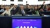 Members of the European Parliament vote in favor of the Paris climate change agreement during a voting session at the European Parliament in Strasbourg, Oct. 4, 2016.