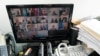 U.N. Secretary-General Antonio Guterres, second from right bottom on a computer monitor at U.N. headquarters, participates in a virtual meeting of the Security Council during the 75th session of the U.N. General Assembly, Sept. 24, 2020.