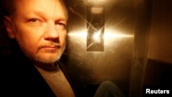 WikiLeaks founder Julian Assange leaves Southwark Crown Court after being sentenced in London, Britain, May 1, 2019. 