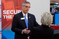 FILE - Georgia Secretary of State Brad Raffensperger attends a conference of local election officials in Savannah, Georgia, Dec. 11, 2019.