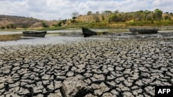 FILE - Aground boats are seen at the almost dried lagoon Las Playitas in Ciudad Dario, Matagalpa some 70 km from Managua on March 31, 2016.