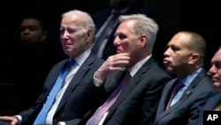 FILE - From left, U.S. President Joe Biden, then-Speaker of the House of Representatives Kevin McCarthy, House Minority Leader Hakeem Jeffries and House Majority Leader Steve Scalise listen during the National Prayer Breakfast, at the Capitol in Washington, Feb. 2, 2023.