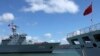 FILE - A Chinese People's Liberation Army (PLA) Navy replenishment ship (L) sails past a PLA Navy hospital ship in a June 24, 2014, photo.
