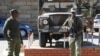 Army personnel man outside the military headquarters in Maseru, Lesotho, Aug. 31, 2014.