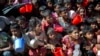 FILE - Rohingya Muslim children, who crossed over from Myanmar into Bangladesh, wait squashed against each other to receive food handouts distributed to children and women by a Turkish aid agency at the Thaingkhali refugee camp in Ukhiya, Bangladesh, Nov. 14, 2017.