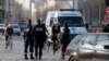 FILE - Police officers in Paris, France, Monday, March 23, 2015.