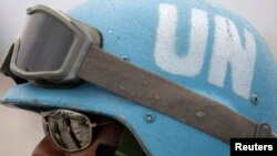 FILE - A UN peacekeeper from Brazil patrols a street in Port-au-prince, Haiti, Jan. 19, 2010. 