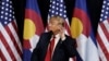 U.S. Republican presidential nominee Donald Trump puts his hand to his ear as he speaks at a campaign rally in Pueblo, Colorado, Oct. 3, 2016. 