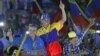 Opposition presidential candidate Henrique Capriles, center, gestures to supporters during his closing campaign rally in Barquisimeto, Venezuela, Oct. 4, 2012. 