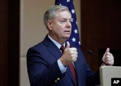 Republican Sen. Lindsey Graham gestures as he speaks to reporters in Ankara, Turkey, Saturday, Jan. 19, 2019, a day after meeting with Turkish President Recep Tayyip Erdogan and other officials. Graham says a U.S. withdrawal from Syria without a plan would lead to chaos and an "Iraq on steroids."