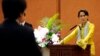 Nobel laureate and Burma opposition leader Aung San Suu Kyi (R) listens to a question from a student during her lecture session at the University of Tokyo in Japan, April 17, 2013.