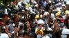 Anti-coup protesters flash the three-finger sign of resistance during a demonstration in Mandalay, Myanmar, March 6, 2021. 