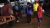 Migrant workers from Burma get off a fishing boat at a seafood market in the town of Mahachai, near Bangkok, Thailand, March 2010. (file photo)