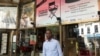 Serge Noukoue in front of the Paris cinema airing the 'Nollywood Week' film festival (Lisa Bryant/VOA)