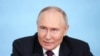 In this pool photograph distributed by Russian state agency Sputnik, Russia's President Vladimir Putin speaks with heads of International news agencies in Saint Petersburg on June 5, 2024.