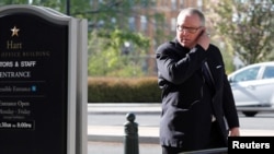 FILE - Michael Caputo arrives to be interviewed by U.S. Senate Intelligence Committee staff members in their offices on Capitol Hill in Washington, May 1, 2018. 
