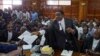 Opposition lawyer and party official James Orengo hands a letter informing him that his own passport has been suspended by the government, to the judge in the case of opposition politician Miguna Miguna, at the High Court in downtown Nairobi, Kenya, Feb. 